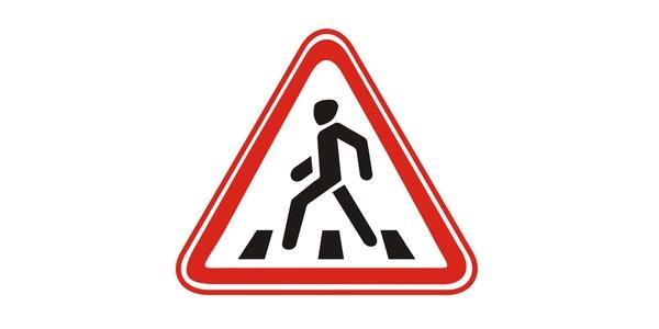 Image: upward-pointing red-edged triangle with a black pedestrian above four dark stripes.
